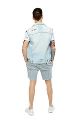 Fototapeta premium Back view of a stylish man in shorts.