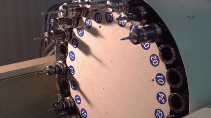 Metalworking at the factory. The computer-controlled machine cuts the part out of aluminum. Machine with program control 4k