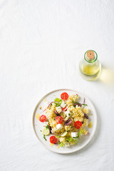 Pasta salad in a plate with olive oil
