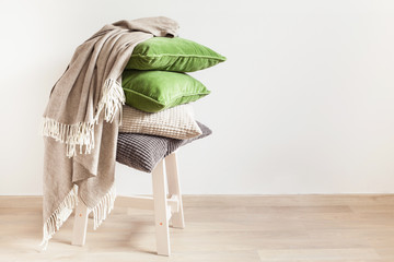 gray and green cushions, throw. cozy home