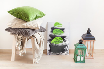 gray and green cushions, throw. cozy home