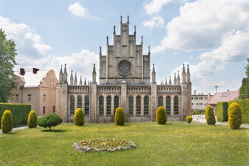 Fototapeta premium Roman Catholic neo-gothic church dedicated to Our Lady of the Scapular. Built in 1909-1912 and expanded in 1953 and 1957. Imielin, Upper Silesia, Poland, Europe. View of the back of the church
