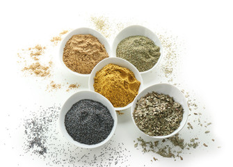 Bowls with various spices on white background