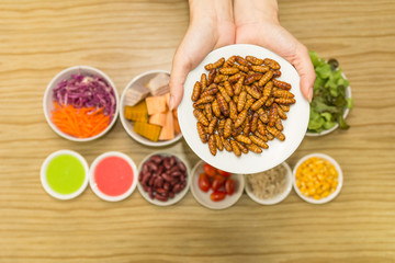 Fresh vegetable salad with worm insects