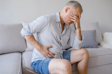  A middle-aged man has a stomach ache