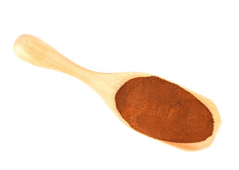 Coffee powder in wood scoop isolated on white background