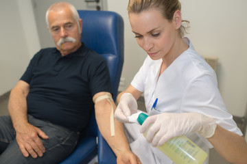 preparation for blood test with beautiful young blond doctor