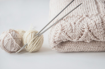 Fototapeta na wymiar Knitting yarn balls, knitted wrap and needles