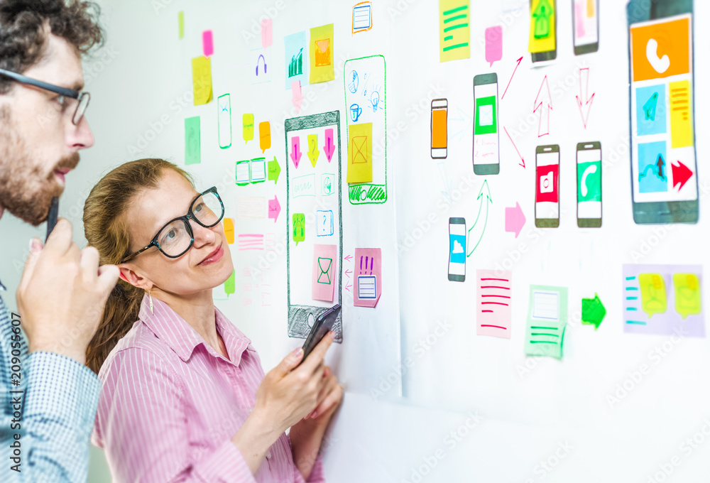 Poster developers of mobile application design applications are discussing new ideas.