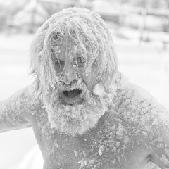 Portrait of a bearded man in the snow