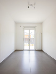 Empty room with window and totally white walls