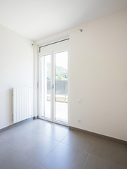 Empty room with window and totally white walls