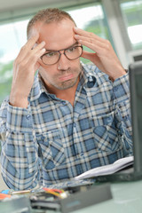 Bemused man at computer