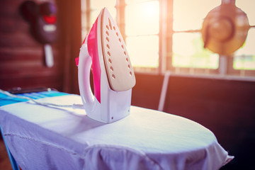 Electric iron put on the cushion