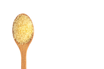 Natural brown sugar or no bleach sugar on wooden spoon on white isolated background in top view flat lay with copy space. Sweet seasoning for good health. Ingredient prepared for cooking or bakery