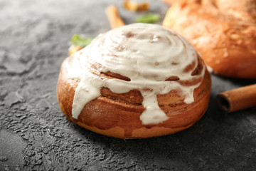 Glazed cinnamon bun on table