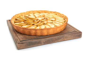 Wooden board with tasty homemade apple pie on white background