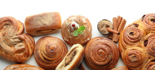 Sweet cinnamon buns on white background