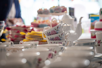 Cups and saucers on table.
