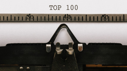 Text Top 100 written in vintage type writer from 1920s