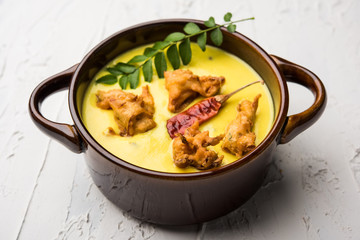 Punjabi Kadhi Pakoda or curry Pakora, Indian cuisine served in a bowl or karahi, selective focus