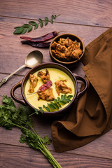 Punjabi Kadhi Pakoda or curry Pakora, Indian cuisine served in a bowl or karahi, selective focus