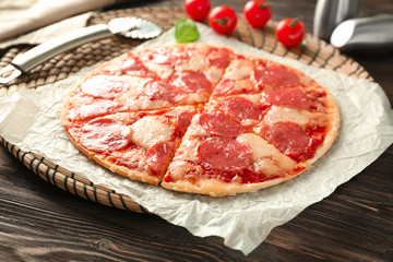 Tasty pepperoni pizza on wooden table