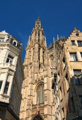 Fototapeta na wymiar Amazing Bell tower with golden watch of the Cathedral of Our Lady. Tower is the highest in the Benelux