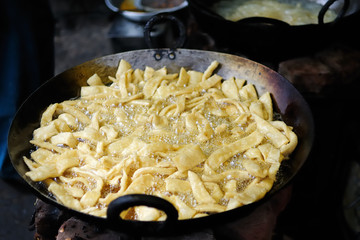 Frying street food in India.