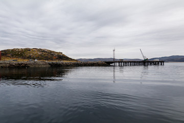 pier in a fishing village of Teriberka , Murmansk region, Russia