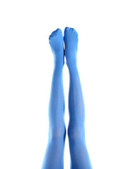 Legs of beautiful young woman in tights on white background