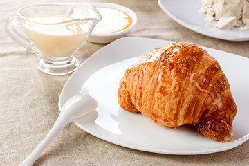 croissant with another sweets on table
