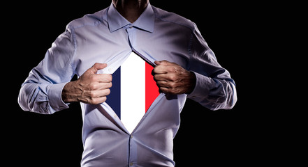 Business man with French flag on black background - 209069422