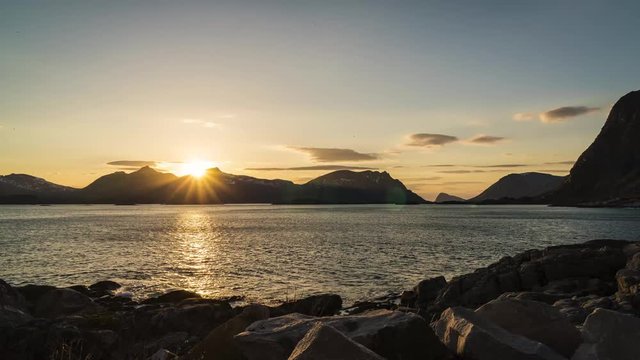 View over the Rorvikstranda beach and Gimsoystraumen fjord near Henningsvaer at Lofoten Islands / Norway by sunset