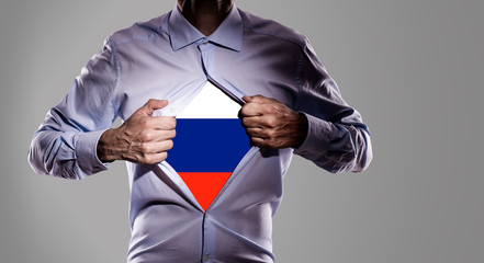 Business man with Russian flag on gray background - 209069877