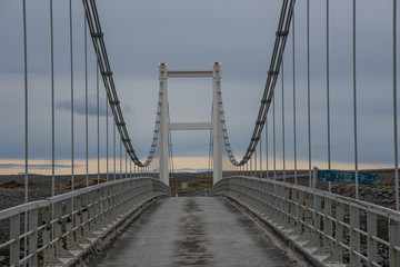Fototapeta na wymiar Bridge crossing river in Northeast Iceland