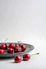 Naklejka na ściany i meble Fresh ripe cherries. Merry. Cherry on a white background