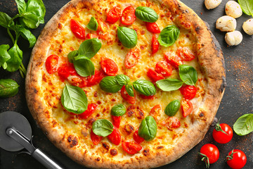 Delicious pizza on slate plate