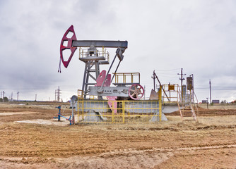 Oil pumps. Oil rocking chair. Oil industry equipment. Oil rocking chair closeup. Outdoor.
