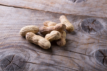 Peanuts on wooden board