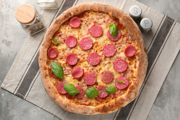 Composition with delicious pizza on table
