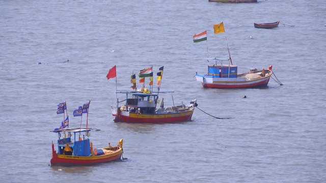Colorful Indian fishing boats moored off the coast of Mumbai
