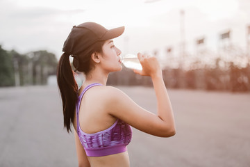Fitness woman drinking water. Fitness and healthy lifestyle concept.