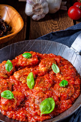 Rustic mini meatballs Baked in tomato sauce with basil