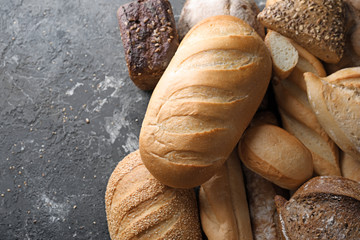 Variety of fresh tasty bread on table