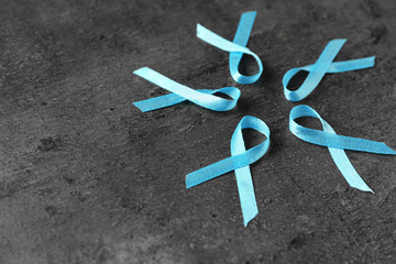 Blue ribbons on dark background. Prostate cancer concept