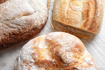 Tasty bakery products on wooden background, closeup