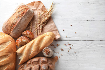 Different bakery products on wooden background