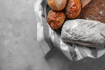 Different bakery products on grey background
