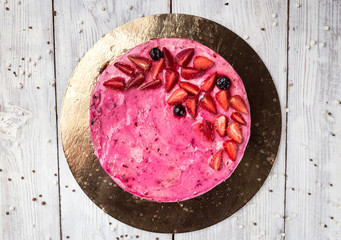 Strawberry Cake dessert with vanilla cream on wooden background